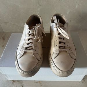Common Projects Nude Sneakers.
